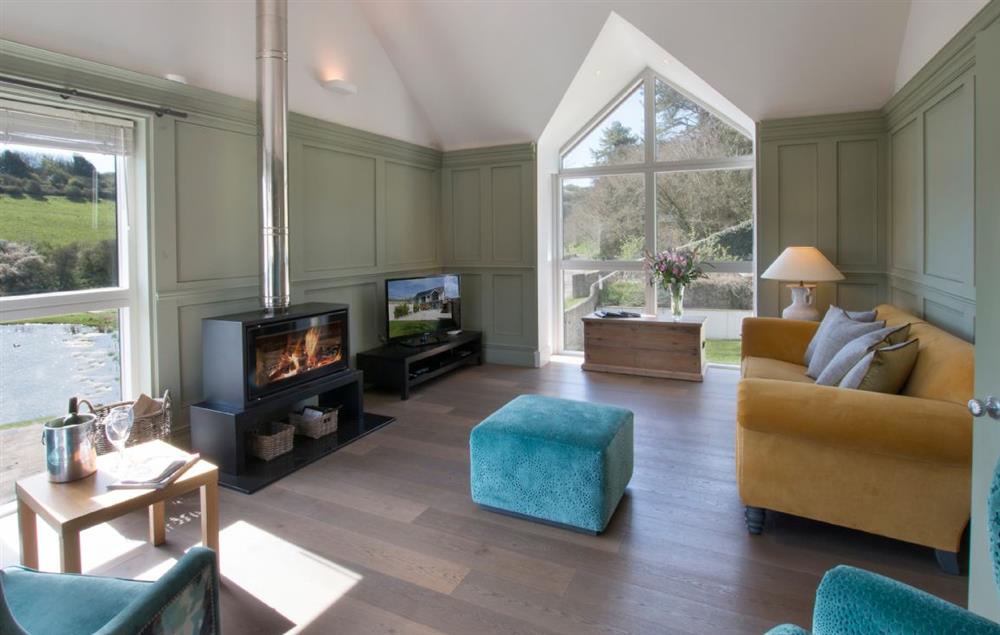 Sitting room with wood burning stove at Brooks Lodge (Sussex), Piddinghoe