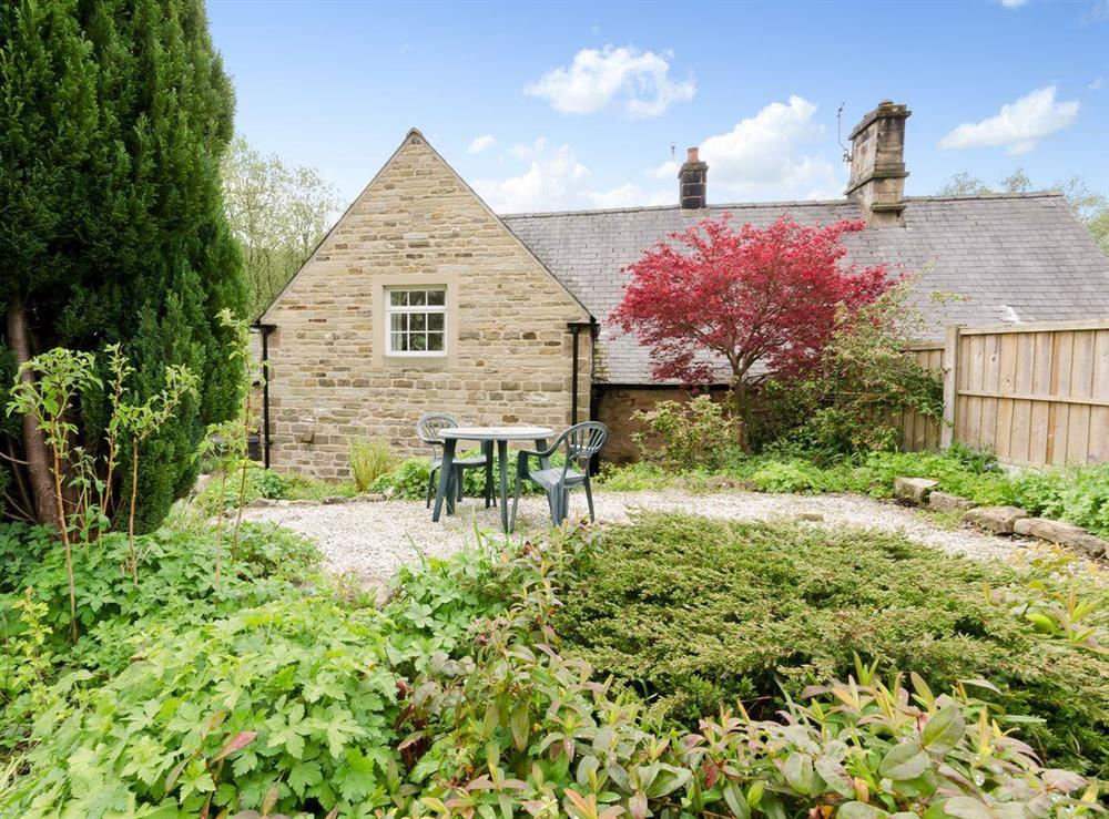 Exterior with sitting out area at Brookside Cottage in Beeley, near Chatsworth, Derbyshire