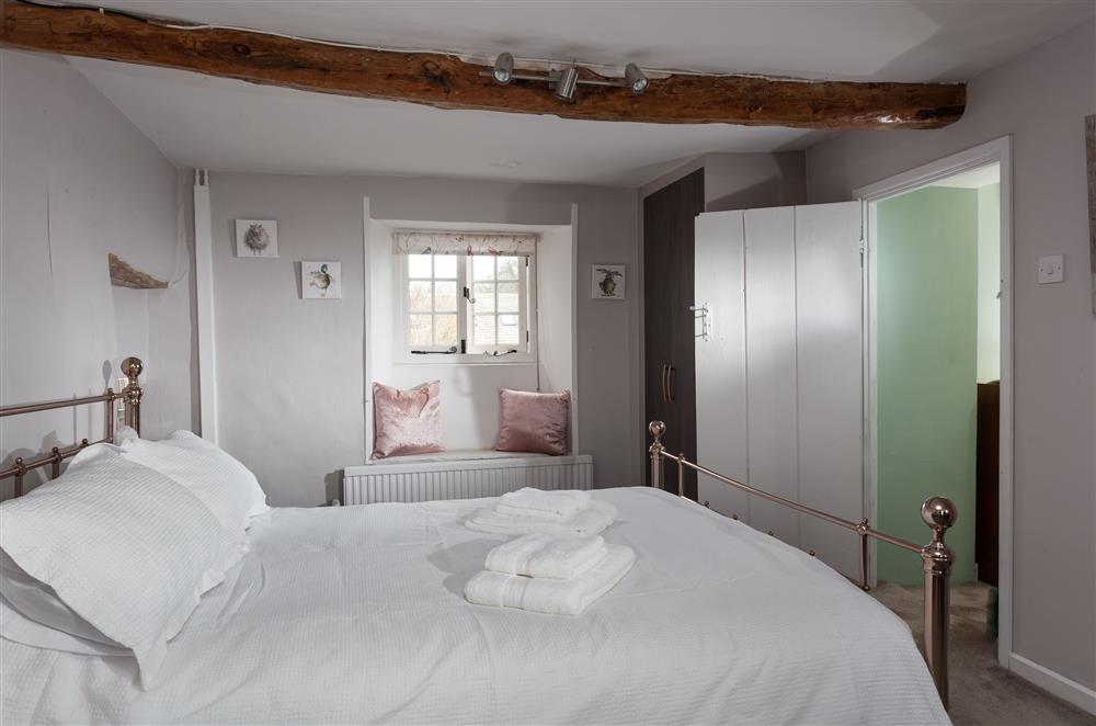 Brookview, Cotswolds: Bedroom one with 5ft king-size bed and exposed beams at Brookview, Lower Swell, Nr Stow-on-the-Wold