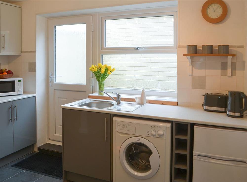 Well equipped kitchen with laundry facilities at Broughs House in North Broomhill, near Amble, Northumberland