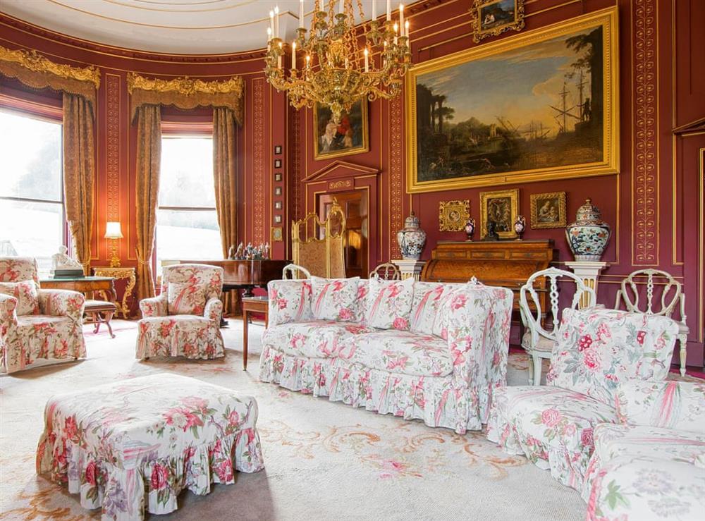 Historic red drawing room at Broughton Hall in Broughton, near Skipton, North Yorkshire