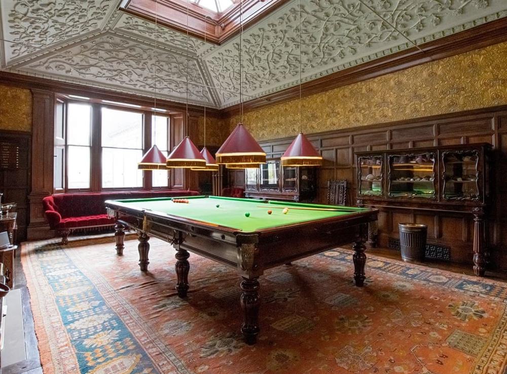 Spacious billiards room with ornate ceiling at Broughton Hall in Broughton, near Skipton, North Yorkshire