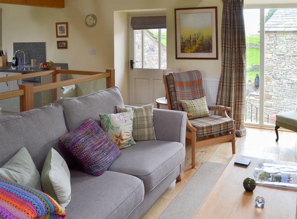 Warm and inviting open plan living area at Brow View Cottage in Ravenstonedale, near Kirkby Stephen, Cumbria