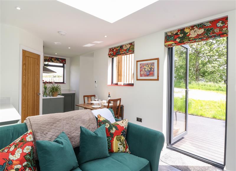 Relax in the living area at Brow Wood Cabin, Ullswater