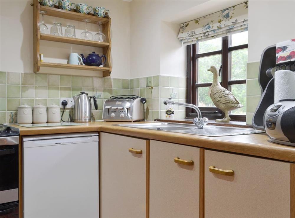 Well-equipped fitted kitchen at Bluebell Cottage, 
