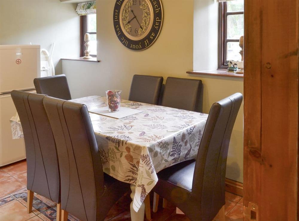 Convenient dining area at Lilly Cottage, 