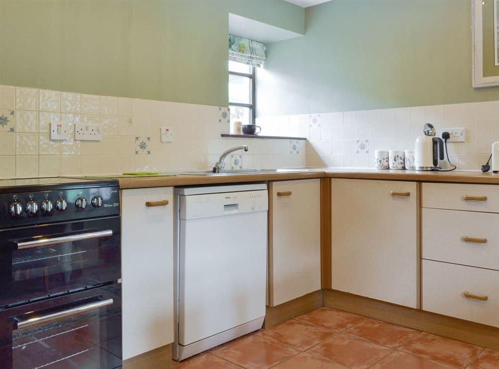 Well-equipped fitted kitchen at Lilly Cottage, 