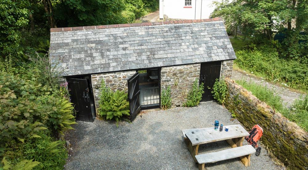 The courtyard and outdoor seating at Brownsham Bothy in Bideford, Devon