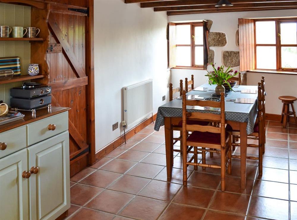 Kitchen with dining area (photo 2) at Bruces Cottage in Whitecross, near Marazion, Cornwall