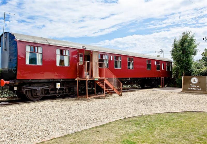Outside Brunel Boutique Railway Carriage 5 at Brunel Boutique Holiday Park in Dawlish Warren, South Devon