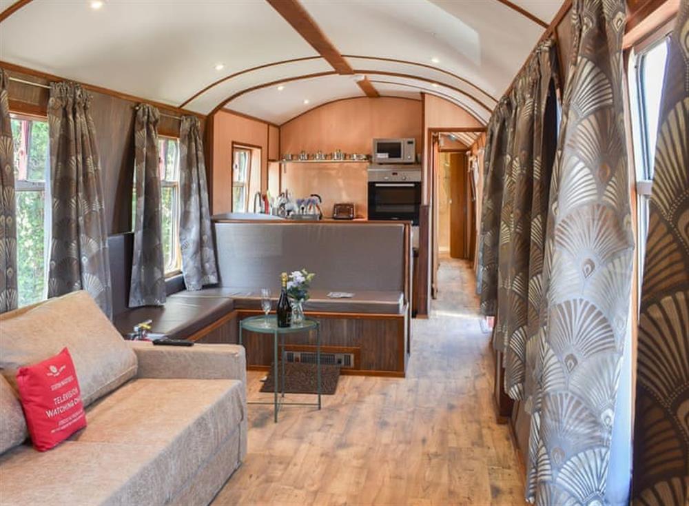 Typical open plan living space at Brunel Boutique Railway Carriage No 1 in Dawlish Warren, Devon