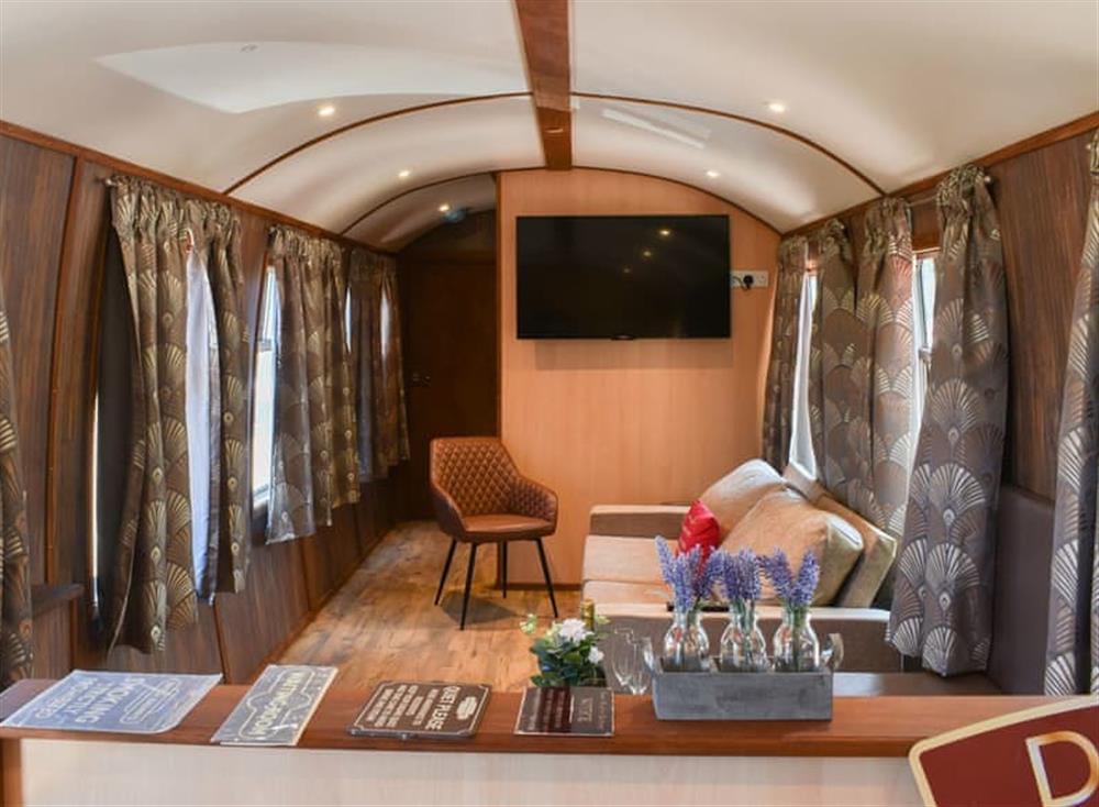 Typical open plan living space at Brunel Boutique Railway Carriage No 3 in Dawlish Warren, Devon