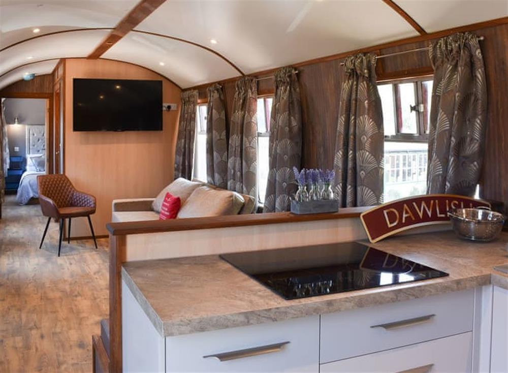 Typical open plan living space at Brunel Boutique Railway Carriage No 4 in Dawlish Warren, Devon