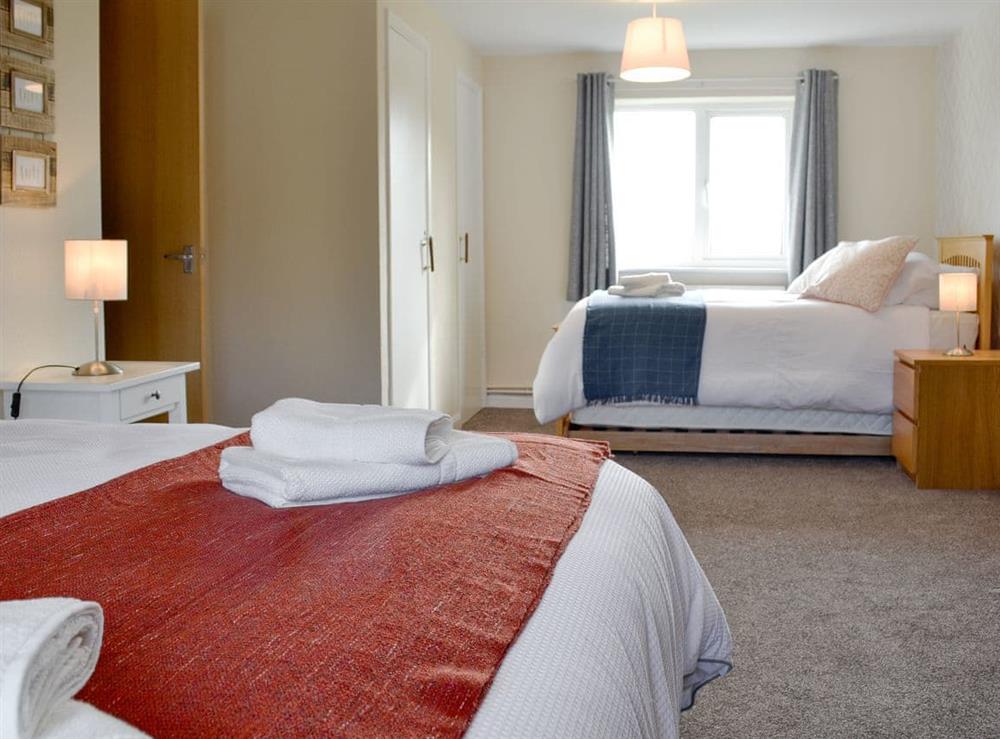 Spacious bedroom zip and link twin beds (can be super kingsize on request), single bed and pull-out bed at Bryn Boda in Nantglyn, near Denbigh, Conwy, Clwyd