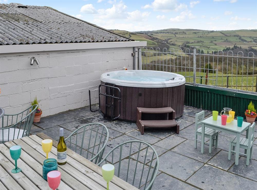 Spacious patio with hot tub & great views at Bryn Boda in Nantglyn, near Denbigh, Conwy, Clwyd