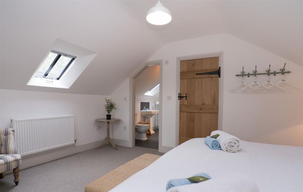 Double bedroom with 5’ king size bed and en-suite shower room (photo 2) at Bryn Derw, Bodnant Estate