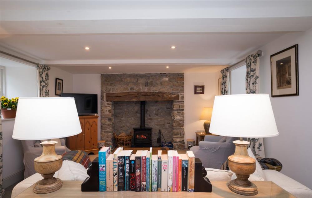 Sitting room with soft lighting throughout at Bryn Derw, Bodnant Estate