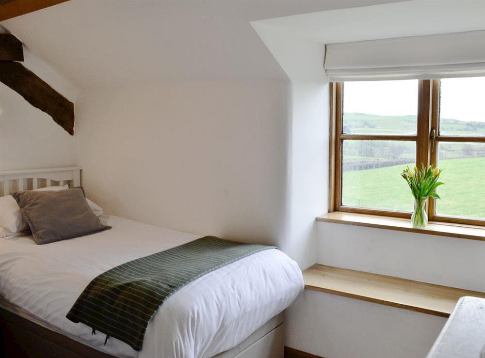 Twin bedroom with views out to the countryside at Bryn Gwnog in Llanrwst, near Betws-y-Coed, Gwynedd