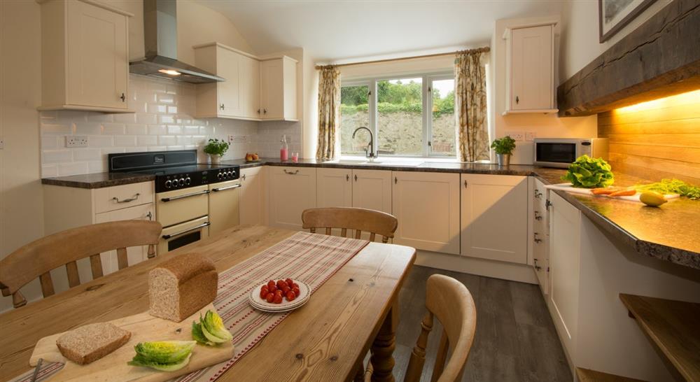 Kitchen and breakfast area at Bryn Llywelyn in Anglesey, Wales