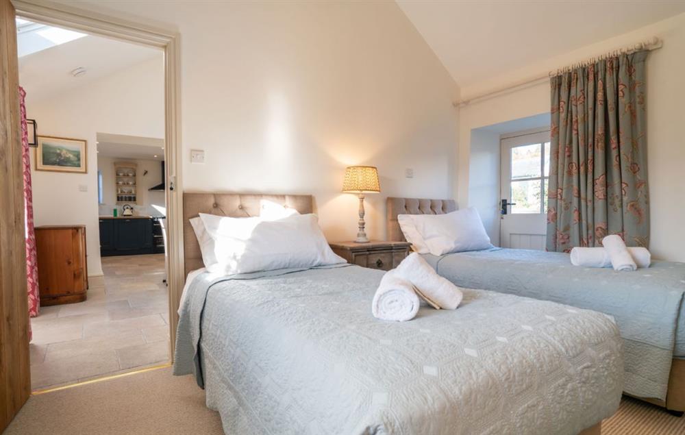 Bedroom with twin 3’ single beds and en-suite shower room at Bryn Mawr, Colwyn Bay