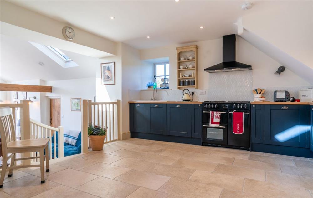Spacious kitchen with steps leading down to sitting room at Bryn Mawr, Colwyn Bay