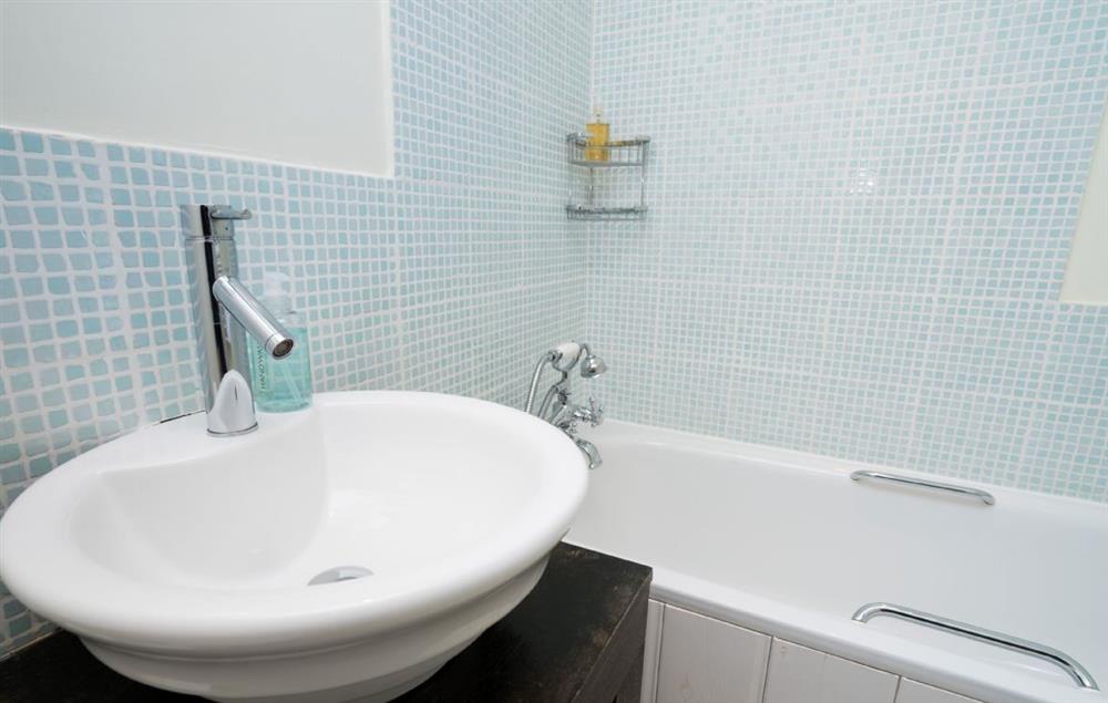 Family bathroom with bath and hand held shower at Bryn Rhydd, Bodnant Estate