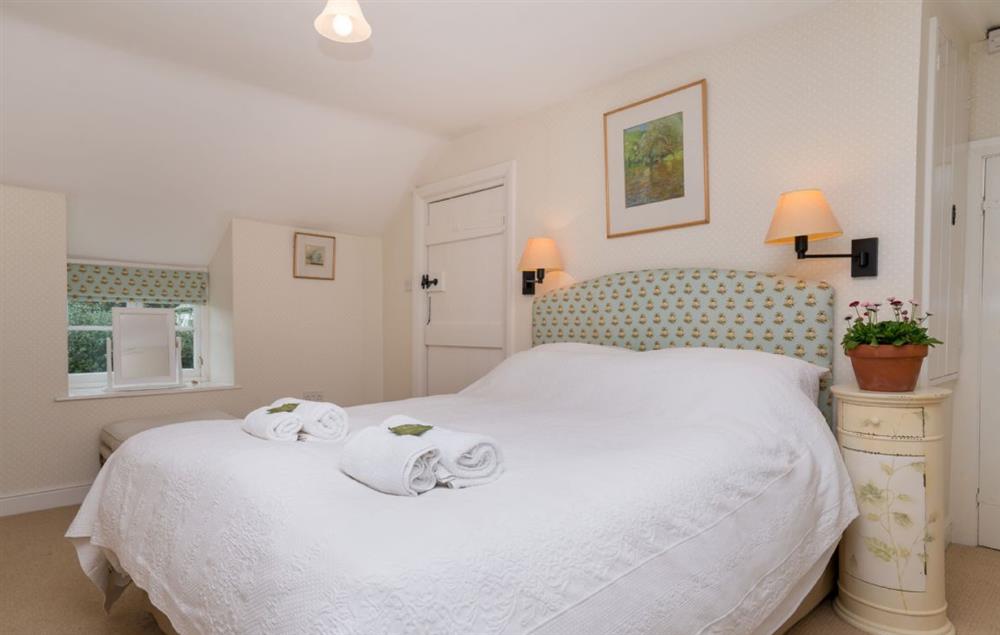 The comfortable double bedroom with king size 5’ bed at Bryn Rhydd, Bodnant Estate
