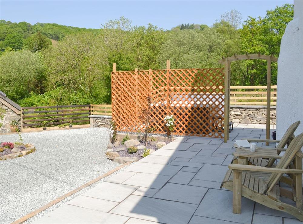 Additional patio area with rural views at Bryn Salem in Cwm-Cewydd, near Machynlleth, Gwynedd
