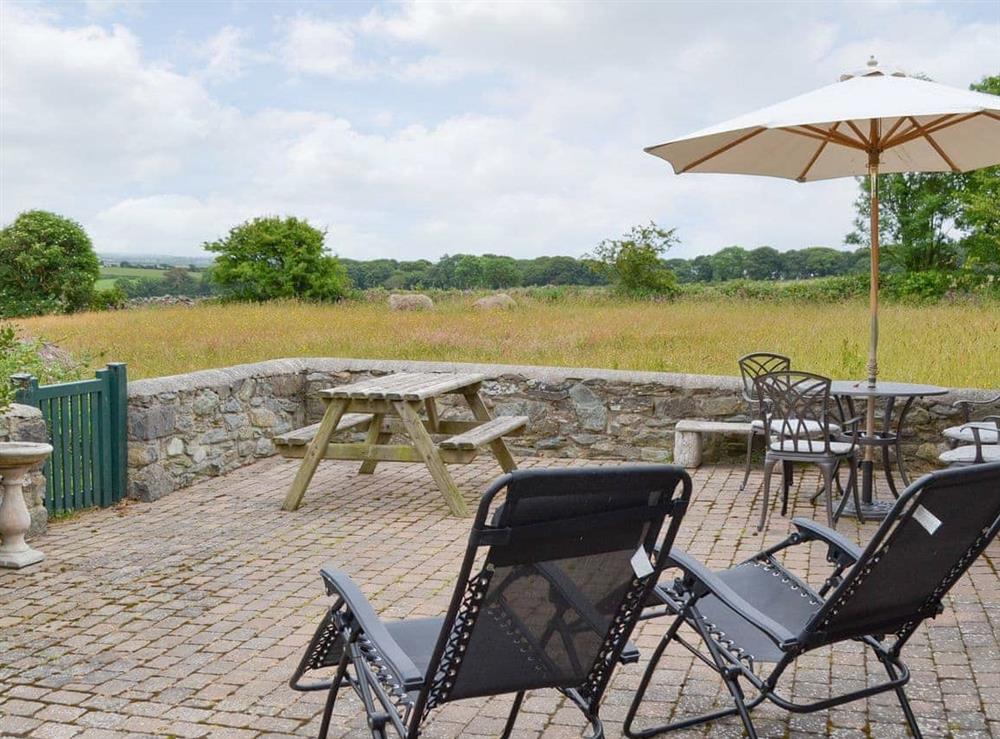 Patio area with outdoor furniture at Bryn Tirion in Trefor, Anglesey, Gwynedd