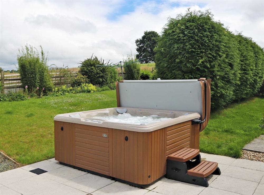Relaxing hot tub with stunning views at Bryn Villa in Howey, near Llandrindod Wells, Powys