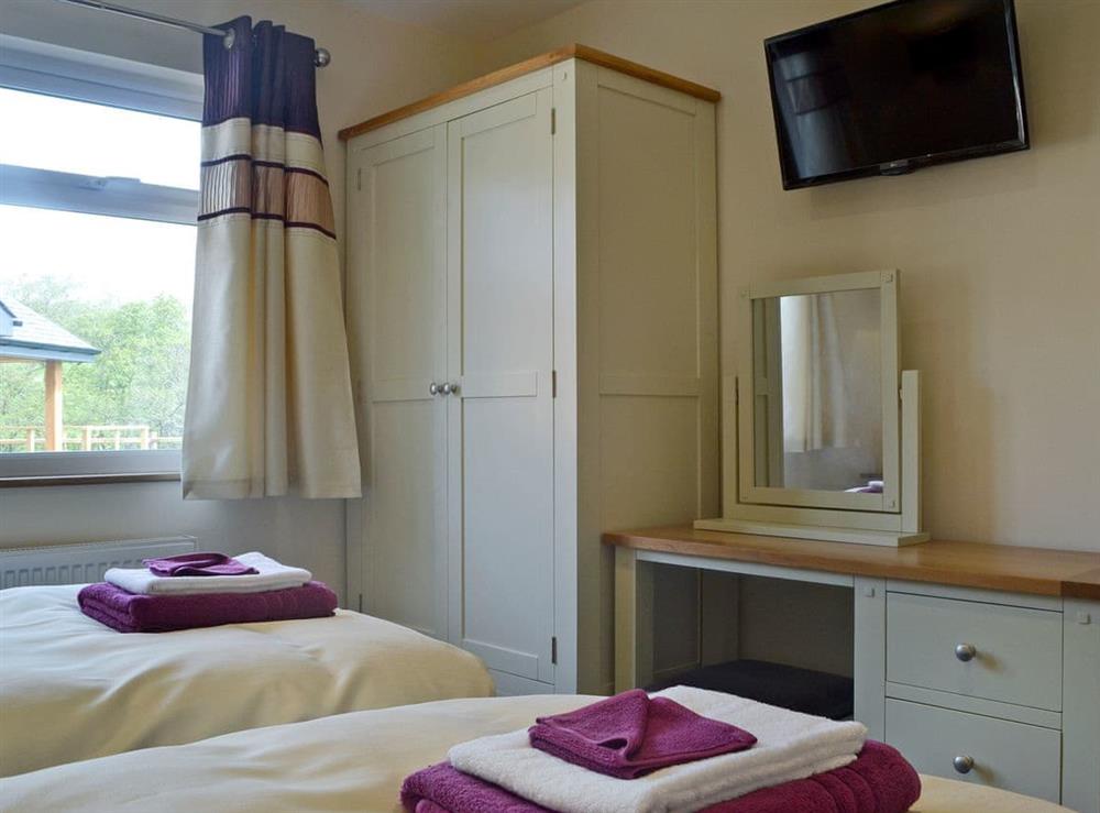 Charming twin bedroom (photo 2) at Woodland Lodge, 