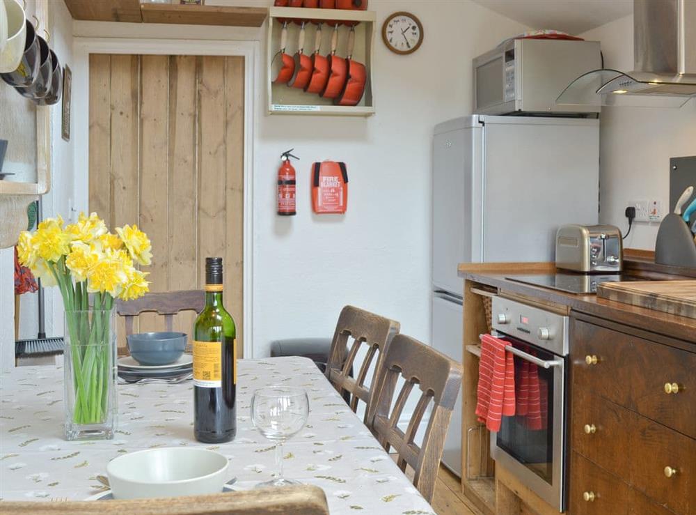 Convenient dining area in well-equipped kitchen at Brynhoreb in Aberystwyth, Dyfed