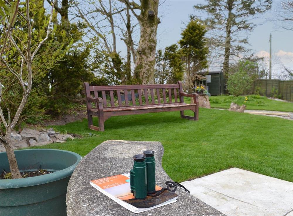 Enjoy the surrounding views from the enclosed garden at Bryntrisant in Devil’s Bridge, near Aberystwyth, Dyfed