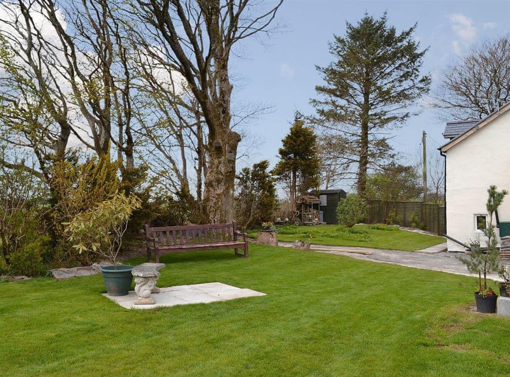 Garden mainly laid to lawn with seating at Bryntrisant in Devil’s Bridge, near Aberystwyth, Dyfed