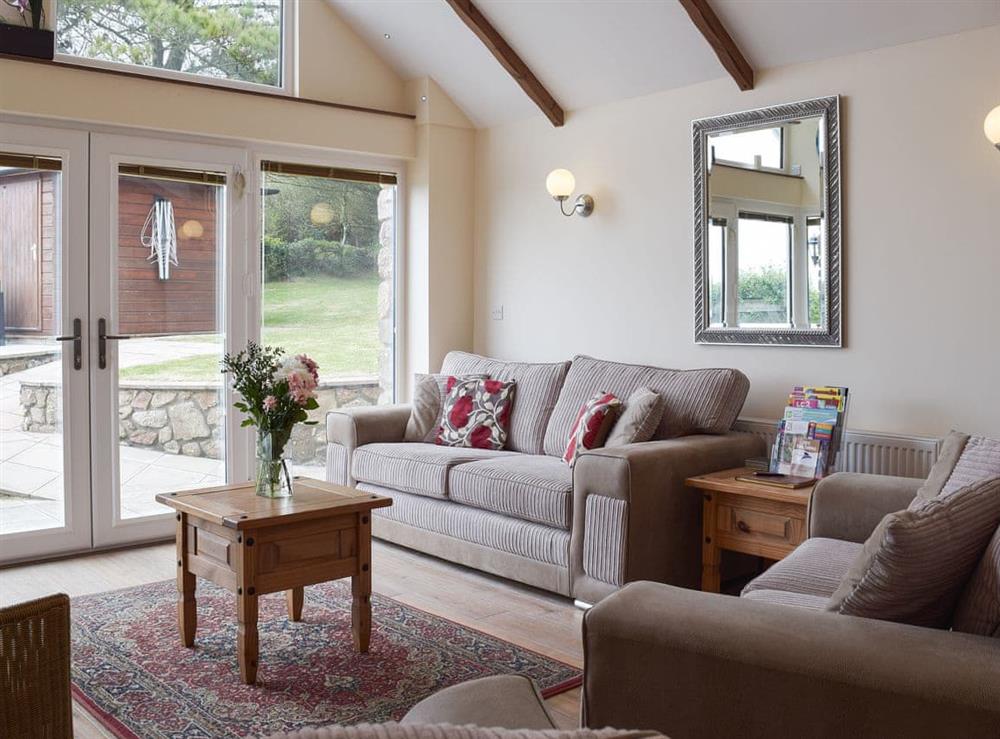 Nicely furnished cosy living room with stunning views at Brynymor Cottage in Llangennith, near Swansea, Glamorgan, West Glamorgan