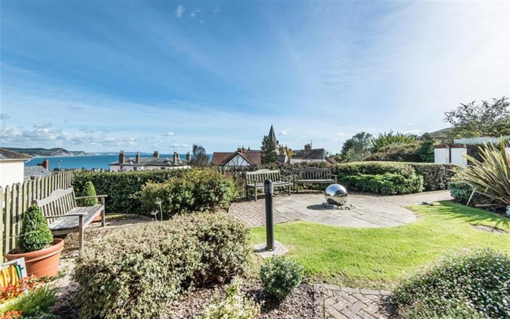 The communal gardens offer a place to relax at Buckfield Penthouse in Lyme Regis