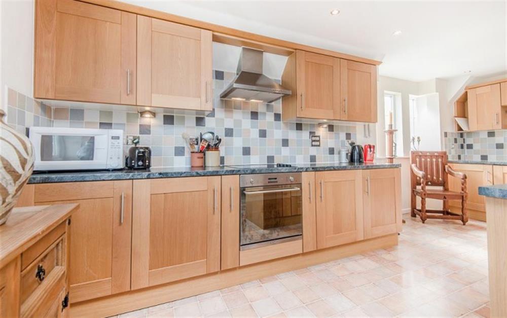 The kitchen includes fridge/freezer, microwave & dishwasher at Buckfield Penthouse in Lyme Regis