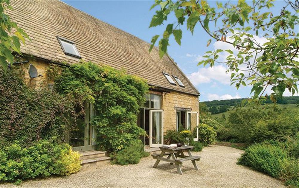 Buckland Wood Barn with accommodation for 4 Guests is a detached Cotswold stone barn on a hillside 1 mile above Broadway