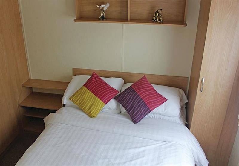 Bedroom in Standard caravan at Bucklegrove Holiday Park in Cheddar, Somerset