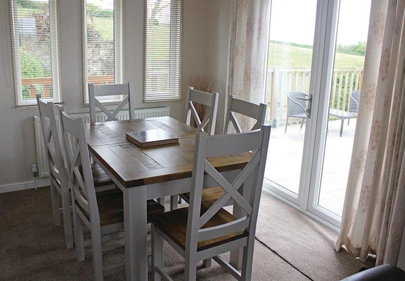 Dining area in a typical Lodge at Bucklegrove Holiday Park in Cheddar, Somerset