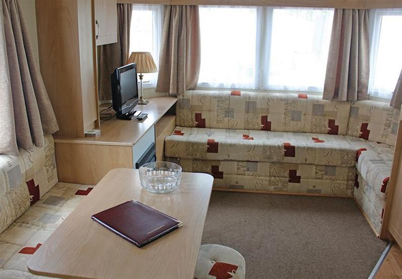 Living room in a typical Standard caravan at Bucklegrove Holiday Park in Cheddar, Somerset