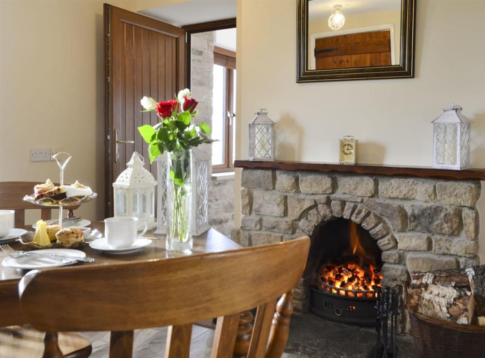 Kitchen and dining area with open fire (photo 2) at Buckswell Cottage in Baldersdale, near Barnard Castle, County Durham, England