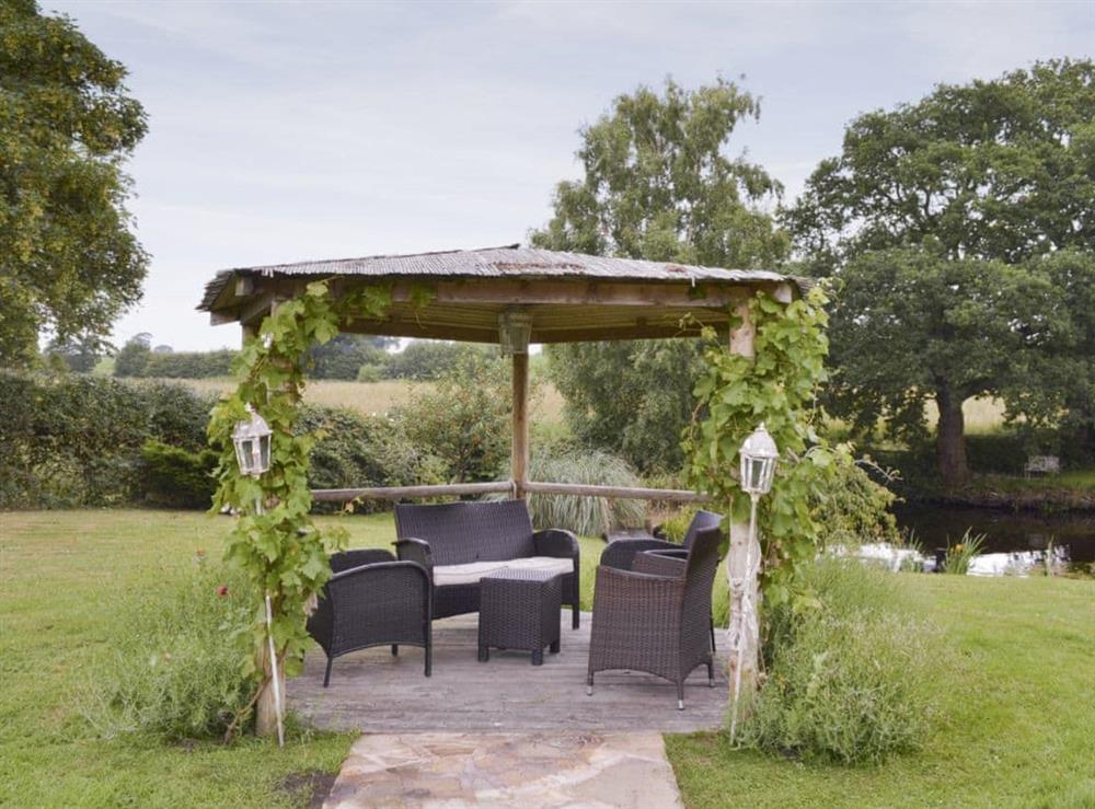Additional outdoor seating area within garden at Buddileigh Farm in Betley, near Crewe, Cheshire