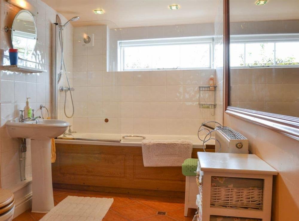 Bathroom with shower over the bath at Bugatti House in Bosbury, near Ledbury, Herefordshire
