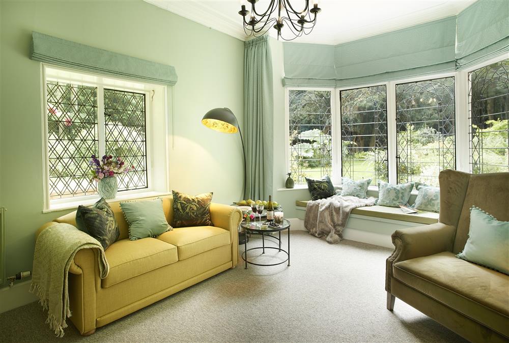 Sitting room with large window and window seat to soak in the outside