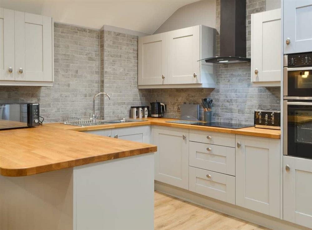Kitchen area at Bumble Cottage in Cockermouth, Cumbria