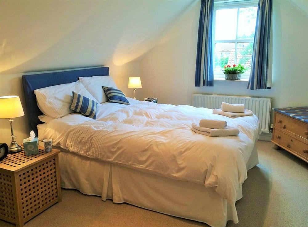 Inviting master bedroom with kingsize bed at Bumble Cottage in Newton-on-the-Moor, Northumberland., Great Britain