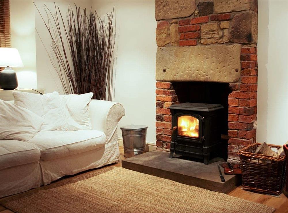 Woodburner set in an interesting original fireplace (logs provided)