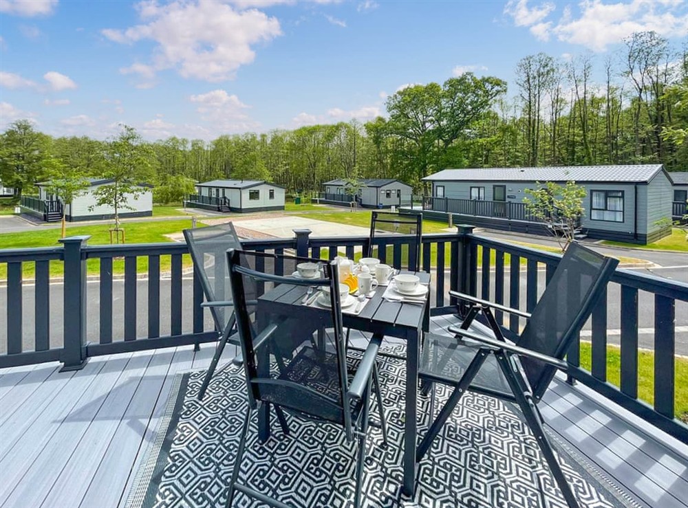 Sitting-out-area at Bumble Lodge in Green Hill Farm Holiday Village, Wiltshire