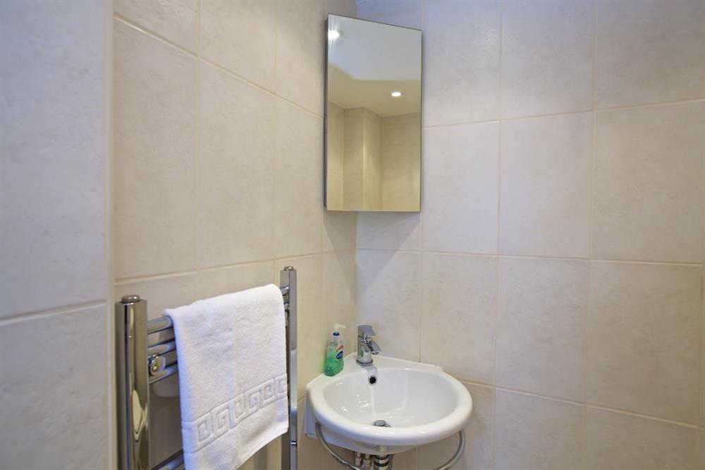 En suite shower room at Bumblebee Cottage in 7 Shadycombe Road, Salcombe